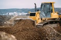 heavy duty machinery, details of excavator pushing earth and building highway. construction site