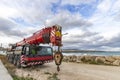 Heavy duty mobile crane parked near the sea. Royalty Free Stock Photo