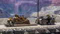 Heavy duty towing vehicle pulls a bulldozer in the Santa Rita open pit Chino copper mine near Silver City, New Mexico.