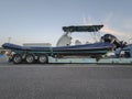 Heavy-duty truck carrying outboard rigid Inflatable boat