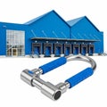 Heavy Duty U- Lock with Blue Grips in Front of a Blue Warehouse Building with Loading Docks Royalty Free Stock Photo