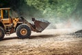 Heavy duty industrial wheel loader loading granite rock and  ore at crushing and sorting plant Royalty Free Stock Photo