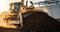 Heavy-Duty Yellow Bulldozer Operating on Construction Site Pushing Earth Sunlight and Dust Creating Dynamic Scene Royalty Free Stock Photo