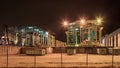 Heavy equipment at illuminated container terminal at nighttime, Port of Antwerp, Belgium. Royalty Free Stock Photo