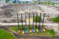 Heavy equipment for installing piles in the ground, heavy machines for driving foundation pillars are lined up. Construction Royalty Free Stock Photo