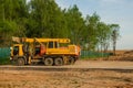 Heavy equipment parked near conctruction site. Industrial sand quarry