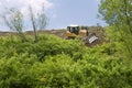 Heavy Equipment Strips Vegetation