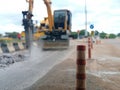 Heavy equipment is working Excavate construction material from the area under the bridgeBlurred images