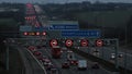 Heavy evening traffic on busiest British motorway M1 near town Luton.