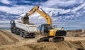 Heavy excavator working on construction site Royalty Free Stock Photo