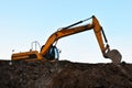 Heavy excavator working at construction site. Royalty Free Stock Photo