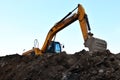 Heavy excavator working at construction site. Royalty Free Stock Photo