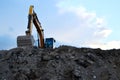 Heavy excavator working at construction site. Royalty Free Stock Photo