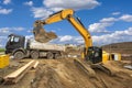 Heavy excavator working at construction site Royalty Free Stock Photo