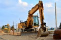 A heavy excavator in working at construction site. Special heavy construction equipment for road construction Royalty Free Stock Photo