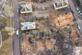 Heavy excavator working at demolition site in ruins of old buildings. aerial drone photo Royalty Free Stock Photo