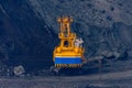 Heavy excavator working in iron ore quarry