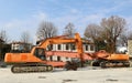 Heavy excavators with boom and bucket for demolition