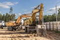 Heavy excavators at a construction site. Construction equipment for earthworks. Quarry excavator. Improvement of the territory and