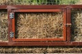 Heavy feeder in stable stall on farm. Convenient feeder for cattle. Interval feeding of animals Royalty Free Stock Photo