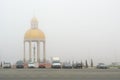 Heavy fog on the freeway. Parking lot, a round chapel in a thick