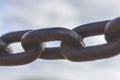 Heavy forged chain on the fence of the Neva embankment. Royalty Free Stock Photo