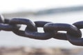 Heavy forged chain on the fence of the Neva embankment. Royalty Free Stock Photo