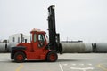 Heavy Forklift loader with concrete pipes Royalty Free Stock Photo