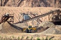 Crusher plant with belt conveyor, crushing process, grinding stone Royalty Free Stock Photo