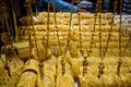 Heavy Golden ornaments kept on display at a shop in Dubai Gold Souk.  Gold Souq is biggest market of Gold Jewelry in world Royalty Free Stock Photo