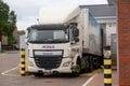 a heavy goods lorry unloading in a lorry loading bay