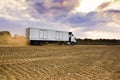 Heavy Goods in Transit via Dirt Roads - Rear View