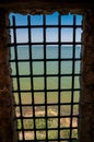A grille in a window opening, castle in Bilhorod, Ukraine Royalty Free Stock Photo