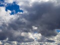 Heavy gray rain clouds in the blue sky. Atmosphere, air, cloudy, soon rain