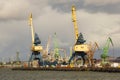 Heavy harbor jib cranes in the Klaipeda Sea Port. Royalty Free Stock Photo