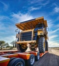 heavy haulage huge mining truck in top of a trailer