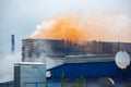 Heavy industrial iron plant emissions into the atmosphere , clouds of orange smoke from old iron factory Royalty Free Stock Photo