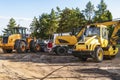 Heavy industrial machinery at construction site parking area Royalty Free Stock Photo