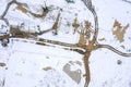 Heavy industrial machines working at winter construction site. preparation of building foundation. top view