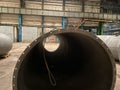 Heavy Industry Engineer Uses Augmented Reality Digital Tablet to Scan Large Diameter Pipe. Modern Industrial Manufacturing