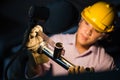 Portrait of young adult experienced industrial asian worker over industry machinery Royalty Free Stock Photo