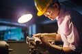 Portrait of young adult experienced industrial asian worker over industry machinery Royalty Free Stock Photo