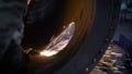 Work grinder cuts metal at the factory. Heavy industry worker cuts a huge pipe Royalty Free Stock Photo