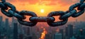 Heavy iron chain links connect against city skyline at sunset. Links rusty showing time, use. Strong metal chain connection to