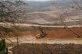 Heavy large quarry dump truck. The work of construction equipment in the mining industry. Production useful minerals. Royalty Free Stock Photo