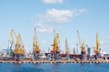 Heavy lifting harbor cranes in the cargo seaport Royalty Free Stock Photo