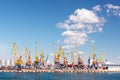 Heavy lifting harbor cranes in the cargo seaport Royalty Free Stock Photo