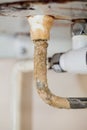 Heavy limescale deposit on a rusty hot water system pipe. Bad pl Royalty Free Stock Photo