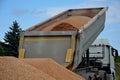 heavy load car. dump a load of gravel into a large pile. Royalty Free Stock Photo