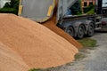 heavy load car. dump a load of gravel into a large pile. Royalty Free Stock Photo